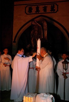 2 priests and candle