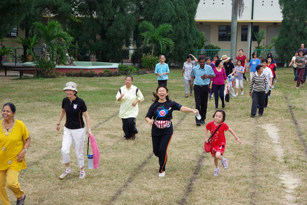 Participants jogging round field before events