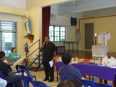 Fr Jude Miranda at parish assembly as observer giving his address