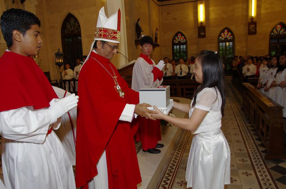 Bishop receiving collection from Confirmands serving as Wardens