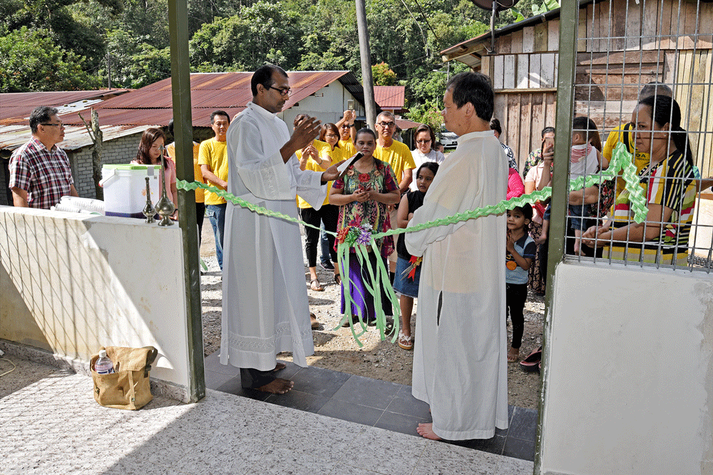 Fr Andrew Steven and Fr Stephen Liew blessing new hall