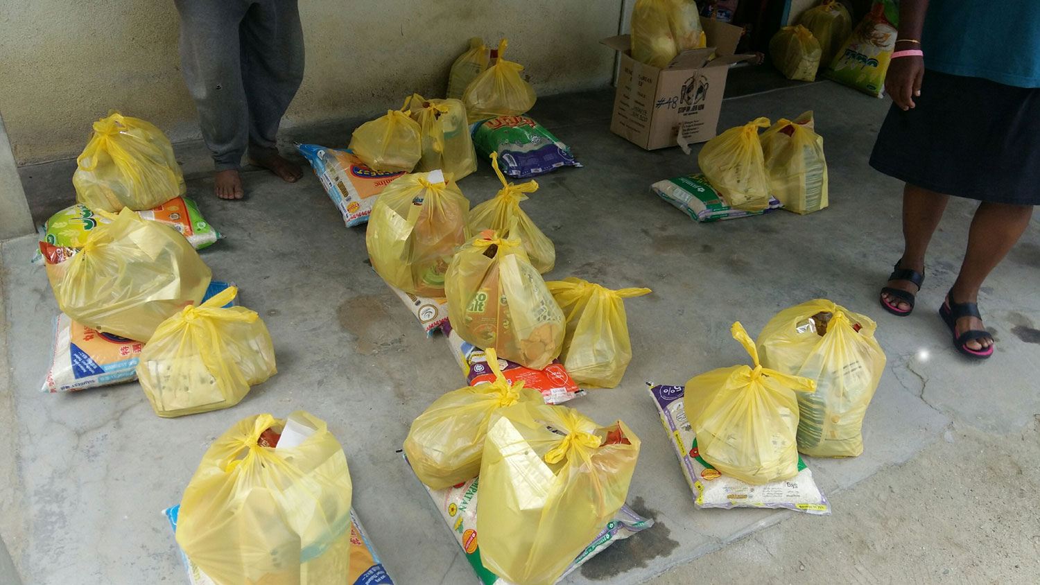 Delivering food aid at Kg Balang