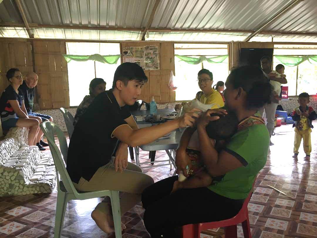 Dr Albert Loo and patient at Kg Sekam