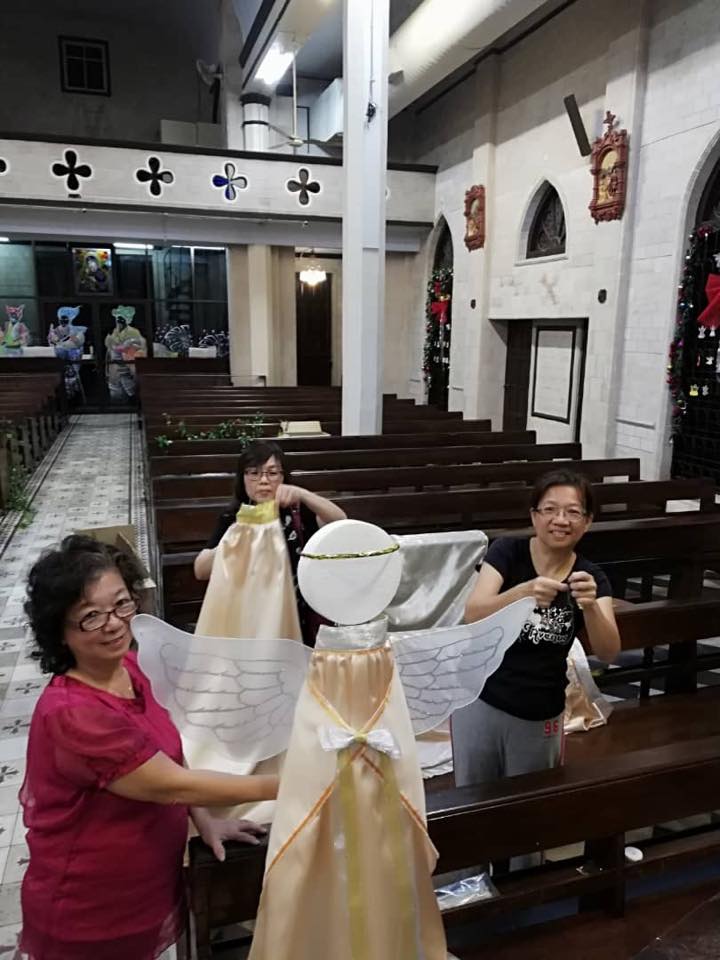 Volunteers decorating the church for Christmas