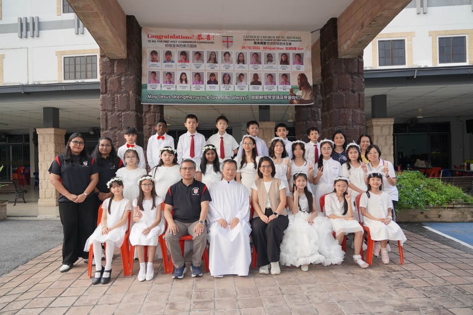 Class of 2026 with teachers and Monsignor Stephen Liew